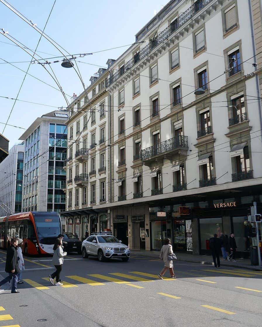 Rue du Rhône in Geneva, the street of fine watchmaking and jewellery boutiques, with its lit shop windows